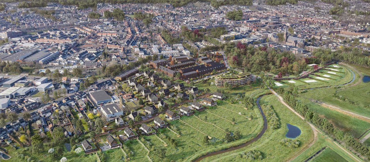 Luchtfoto van het gebied in Goirle vóór de start van het nieuwbouwproject Land van Anna, met zicht op het bestaande landschap en omliggende bebouwing.