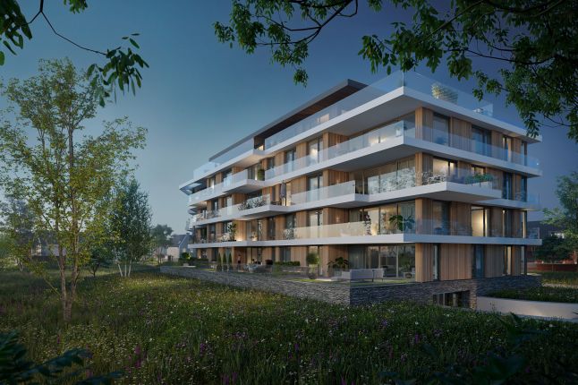 Nachtimpressie van de nieuwbouwappartementen in Land van Anna in Goirle, met warme verlichting en zicht op de moderne gevels.