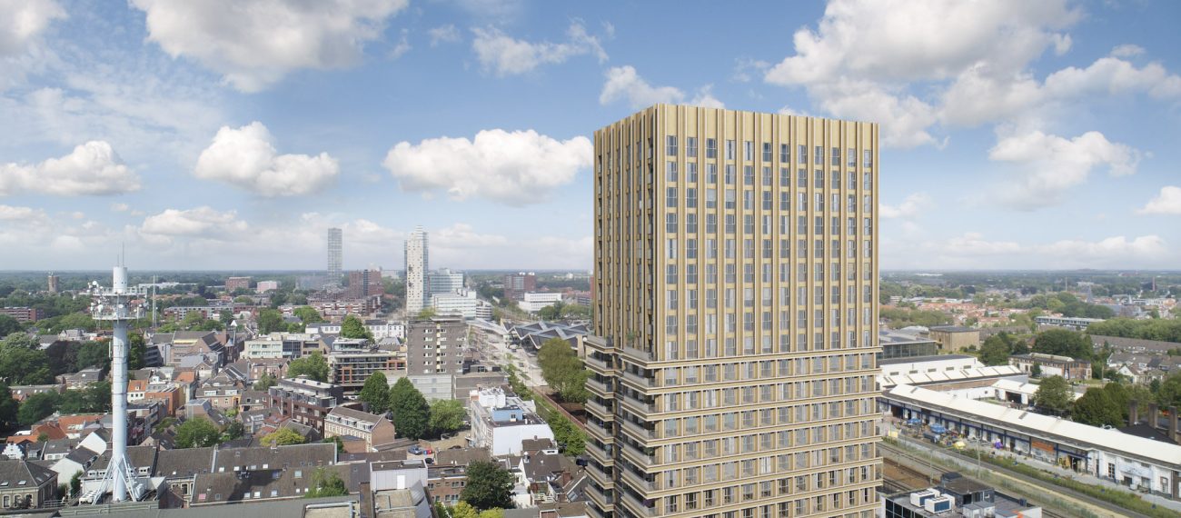 Goudkleurige toren met verticale lamellen aan de spoorzone, skyline Tilburg — Nieuwbouw De Bankier Tilburg
