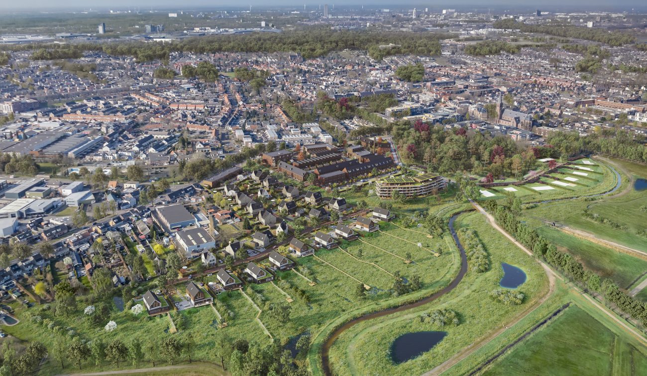 Luchtfoto van het gebied in Goirle vóór de start van het nieuwbouwproject Land van Anna, met zicht op het bestaande landschap en omliggende bebouwing.