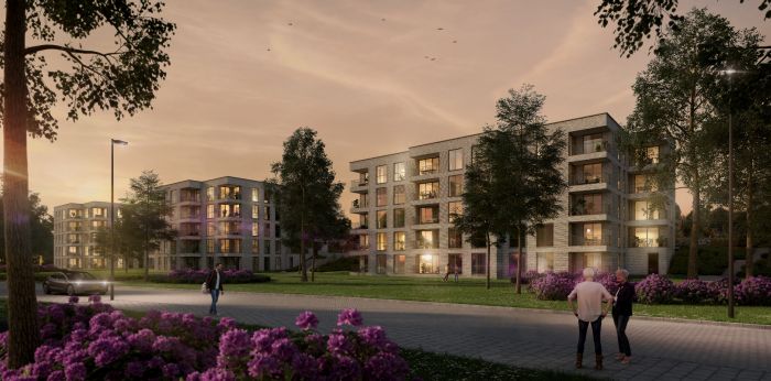 Impressie van het nieuwbouwproject De Jonkvrouw in Geldrop, met warme avondzon die de gevel van het appartementencomplex verlicht.