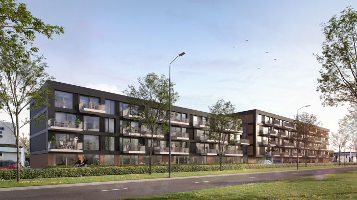 Maison L’Europe Helmond – lang vierlaags appartementengebouw met donkere gevel, grote glaspartijen en balkons langs een groene stadslaan