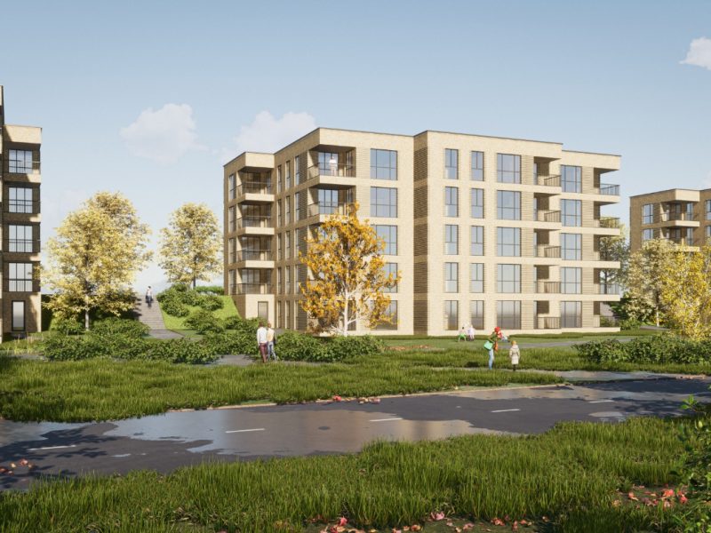 Impressie van het nieuwbouwproject De Jonkvrouw in Geldrop, met weelderig groen en beplanting rondom het appartementencomplex.