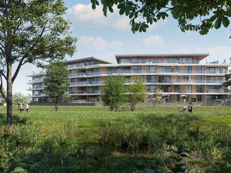 Overdagimpressie van de nieuwbouwappartementen in Land van Anna in Goirle, gezien vanaf het park met zicht op het groene landschap en de moderne gebouwen.